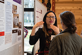 An MPH student shares her research findings. Photo by Elizar Mercado.