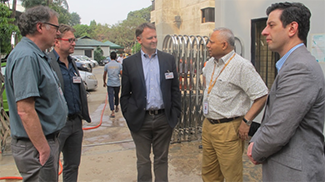 UW faculty, including Dr. Paul Drain and Dr. Jerry Cangelosi, outside of the cholera hospital with icddr,b Director Dr. Tahmeed Ahmed