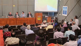 Jerry Cangelosi (Environmental and Occupational Health), Barry Lutz (Bioengineering), Javeed Shah (Allergy and Infectious Disease) and Paul Drain (Global Health) present their work during a seminar on UW’s global TB research.