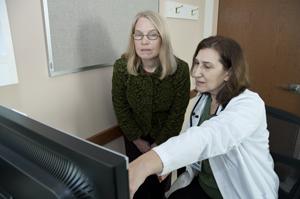 Clinic director Debra Milek (at right in photo) confers with research industrial Hygienist Nancy Beaudet. Clinic director Debra Milek (at right in photo) confers with research industrial Hygienist Nancy Beaudet.