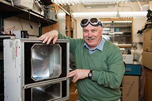 Michael Yost with an Orca LRS-50 Aerosol LIDAR (Light Detection And Ranging) he customized to better measure aerosol density over a section of sky. Michael Yost with an Orca LRS-50 Aerosol LIDAR (Light Detection And Ranging) he customized to better measure aerosol density over a section of sky.