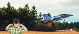 Jet Noise and Child Health Boy covering his ears next to a jet taking off.