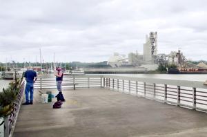 Two men fishing on the Duwamish River Two men fishing on the Duwamish River