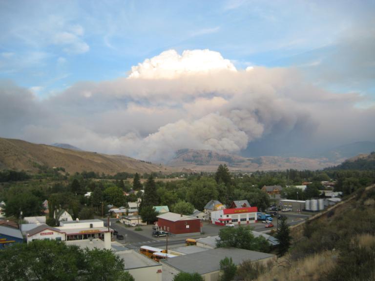 A cloud of wildfire smoke looms over a town in Washington's Methow Valley