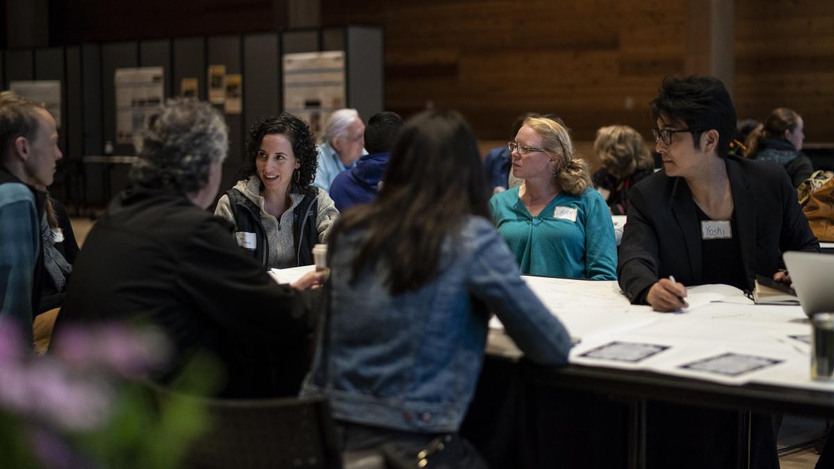 Workshop participants engage in small group discussion.