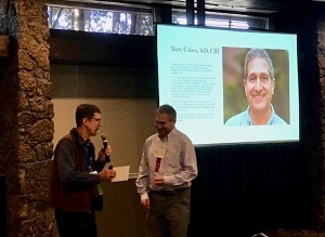 Marty Cohen receiving an award