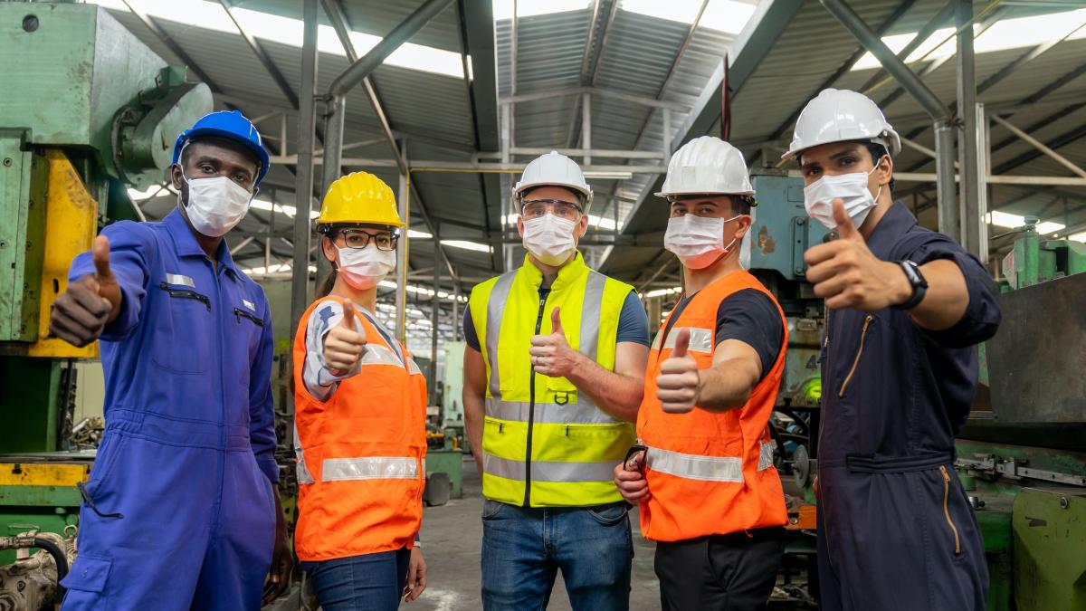 workers giving thumbs up 