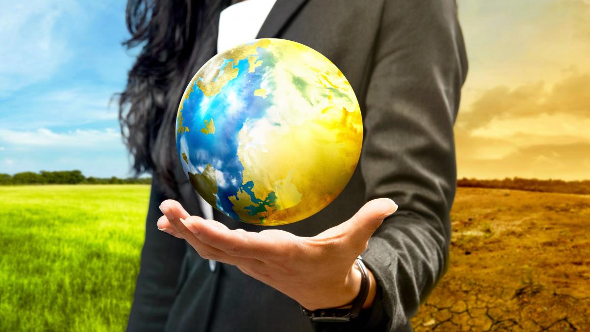 business woman holding the globe