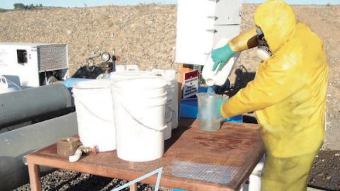 image of worker mixing pesticides