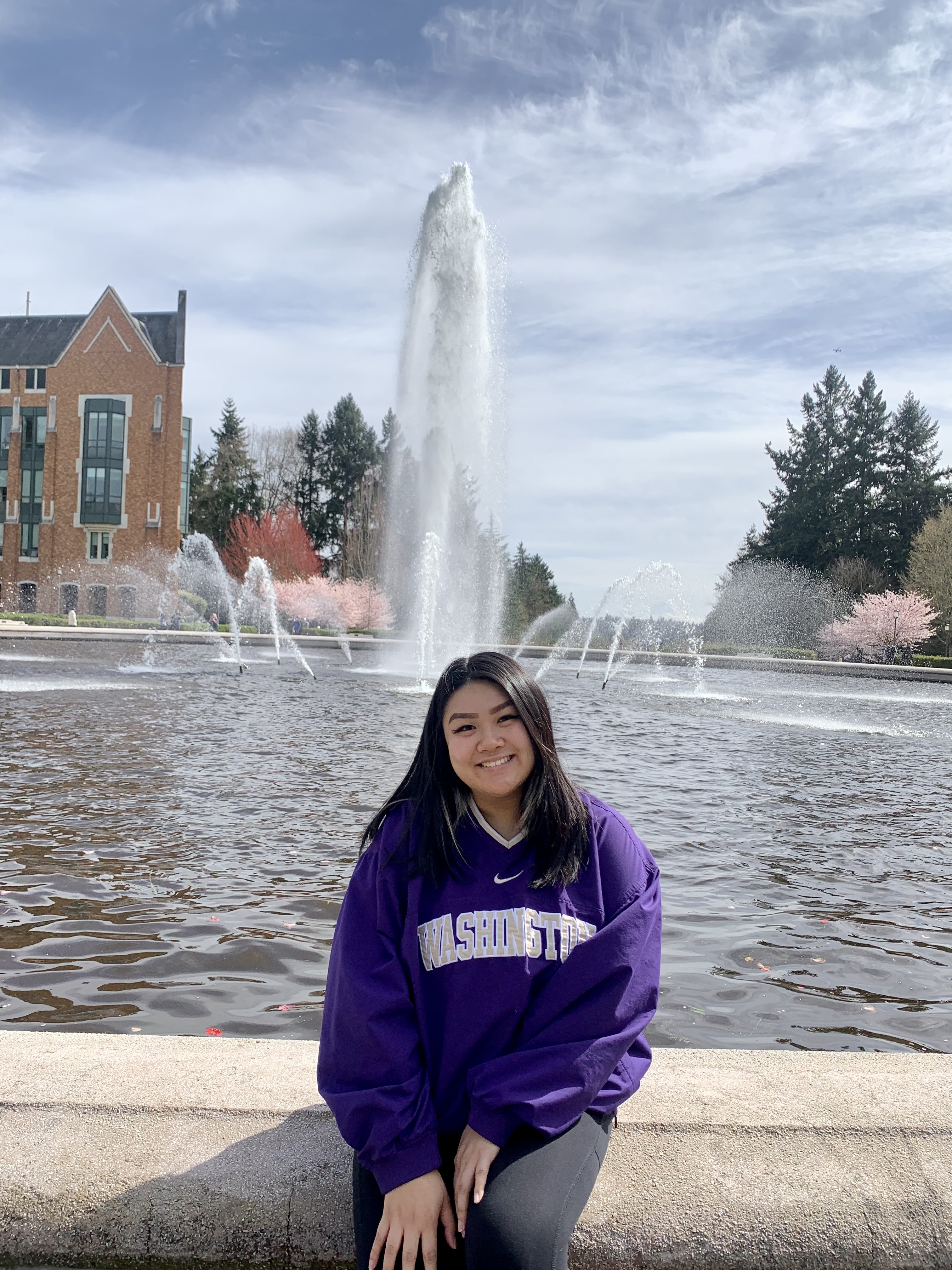 Helen sitting by UW's Drumheller Fountain