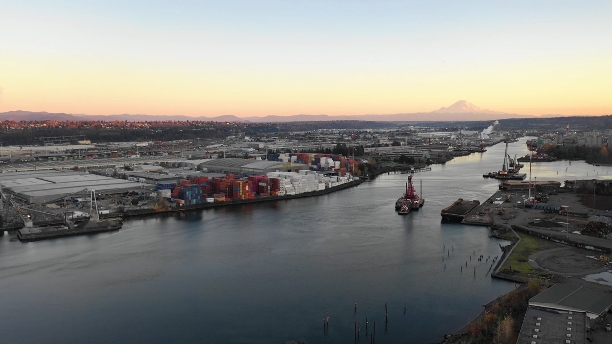 An aerial shot of the Duwamish River Valley with Mount Rainier in the distance.