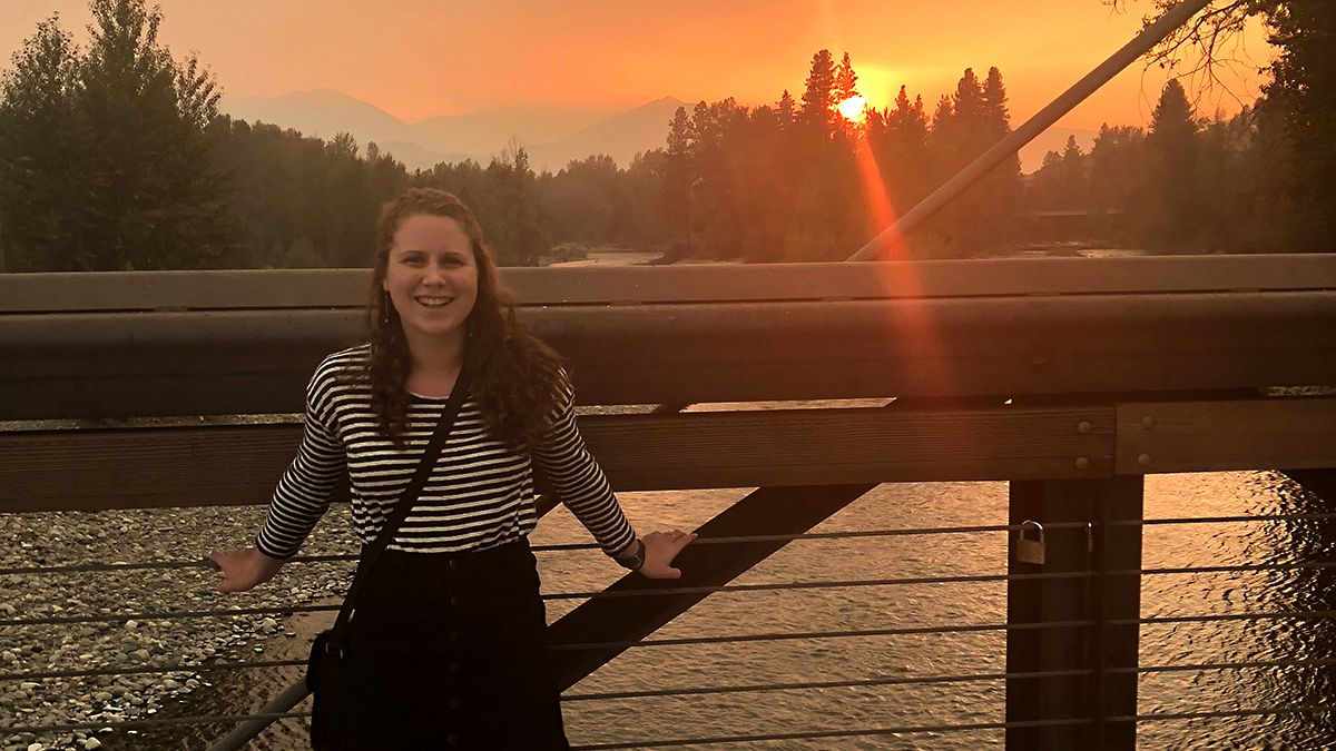 Amanda Durkin stands on a bridge in the smoky Methow Valley.