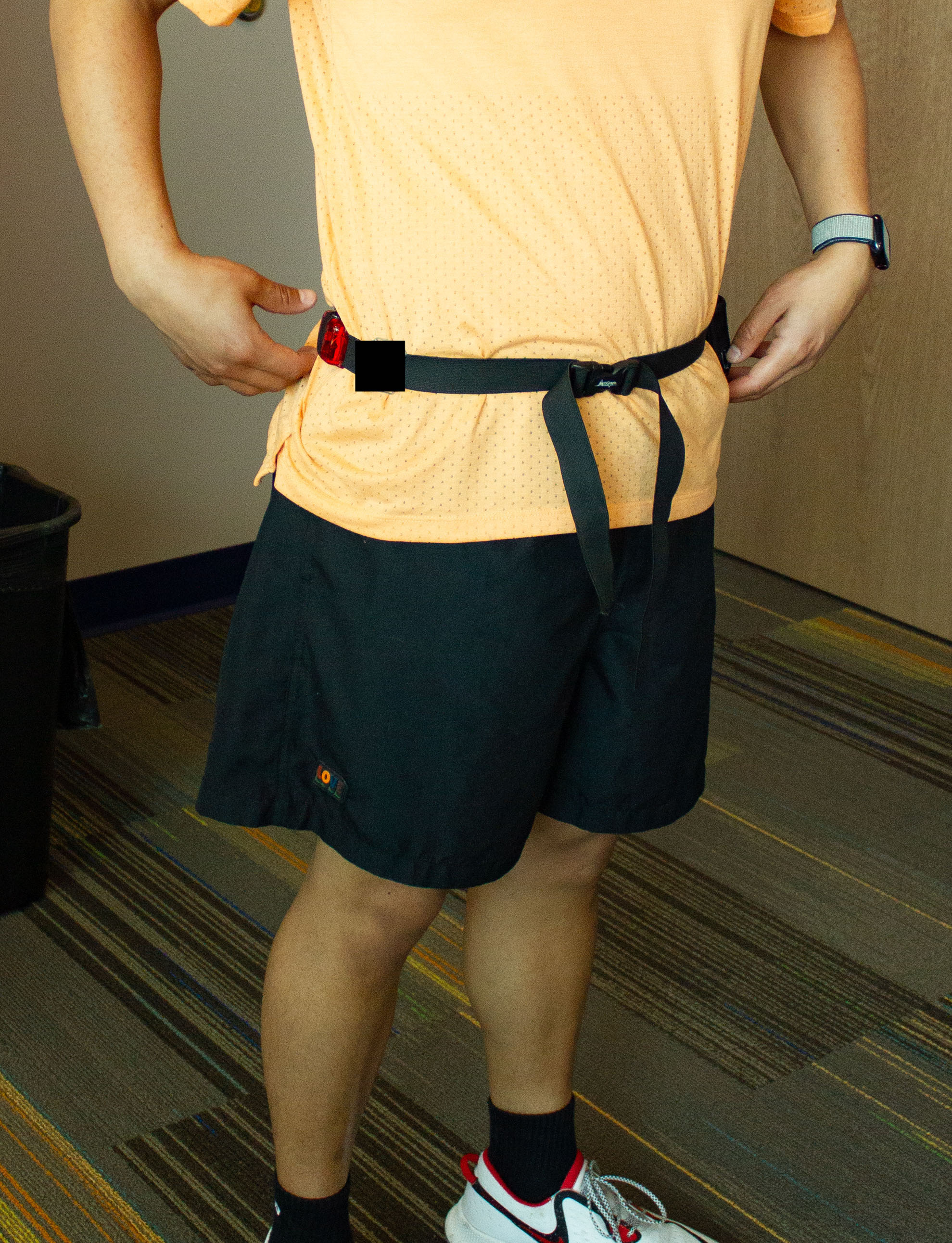 Belt can be placed right above the waistband of your pants on the outside of your clothing. 
