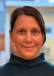 Headshot of a woman in a turtleneck