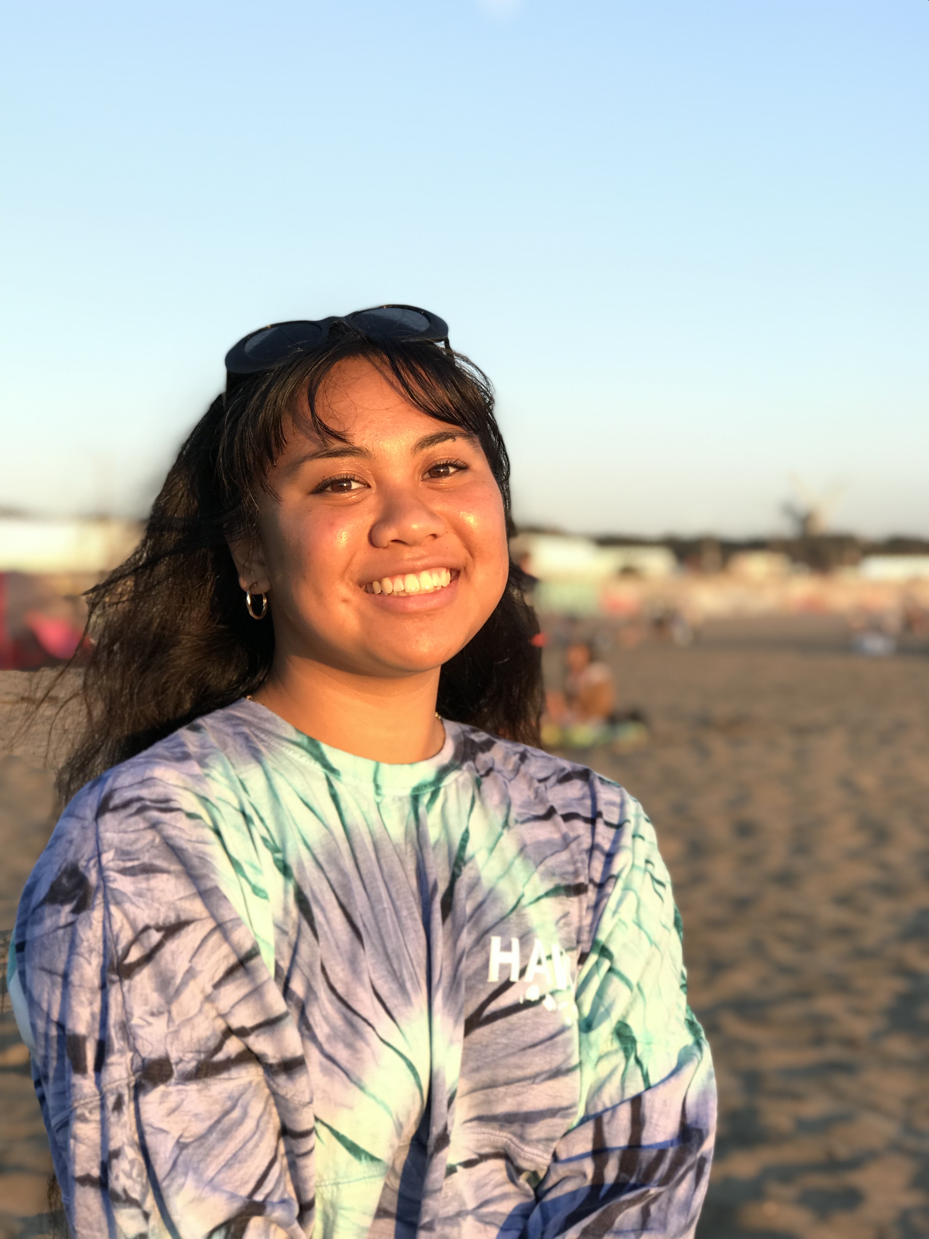 Amanda is standing on a beach