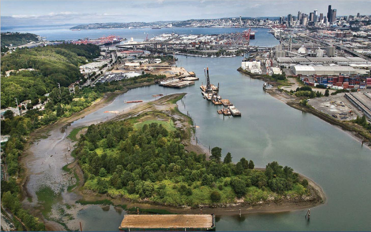 An aerial view of a river cutting through an industrial area on its way to Elliott Bay.