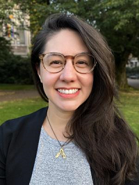 Headshot of Marie Spiker smiling outside.