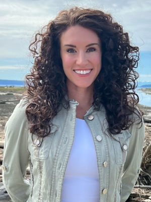 Woman with long dark brown curly hair
