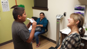 Dr. Karr and participant performing spirometry.  Photo by HAPI Project.