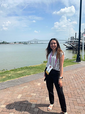 Vallejo stands next to a bridge over a lake in New Orleans.