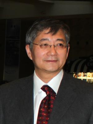 Dr Bao, an older Asian man with gray hair and small oval glasses