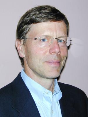 Steven Gilbert, a middle-aged white man with brown hair and clear glasses