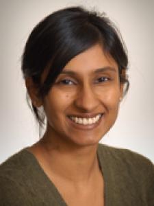 Dr Sathyanarayana, a young Indian woman with her hair pulled back