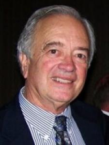 Headshot of Clem Furlong, an older white man with gray hair in a striped shirt and tie