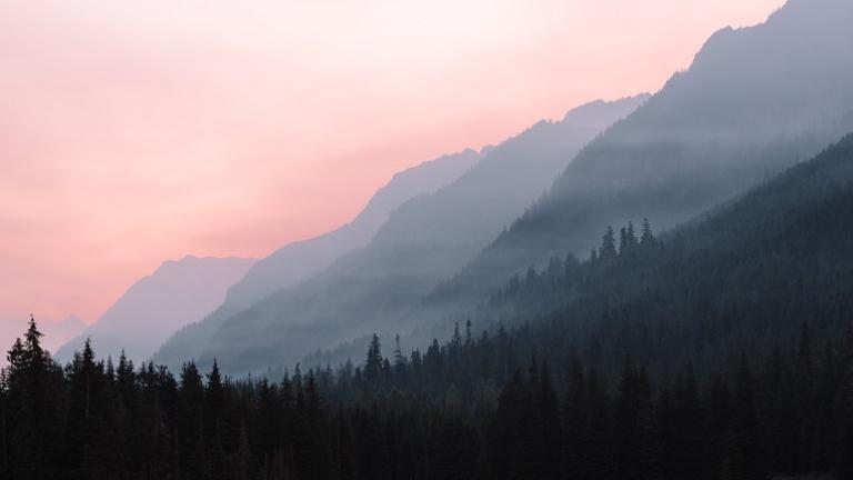 Smoke-filled air over mountains and forestry