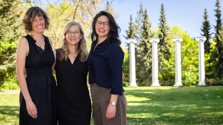 Sarah Collier, Jennifer Otten and Marie Spiker stand together on the UW campus.