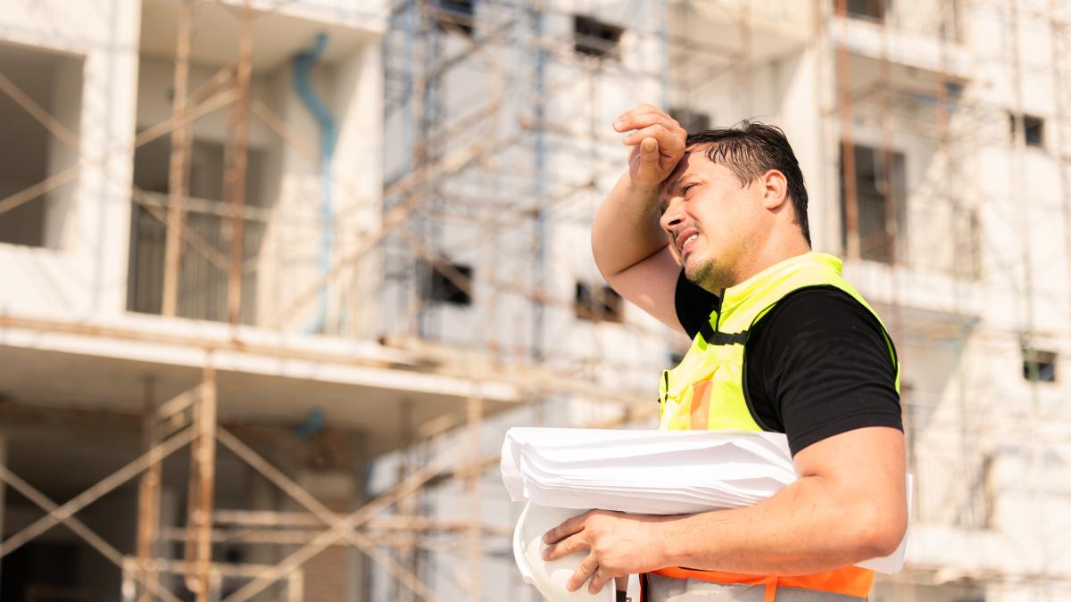 Man working construction outside in the hot sun. 