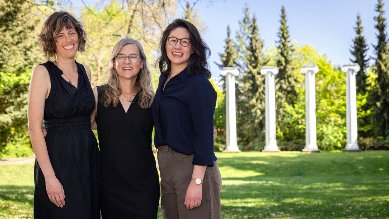 Sarah Collier, Jennifer Otten and Marie Spiker stand together on the UW campus.