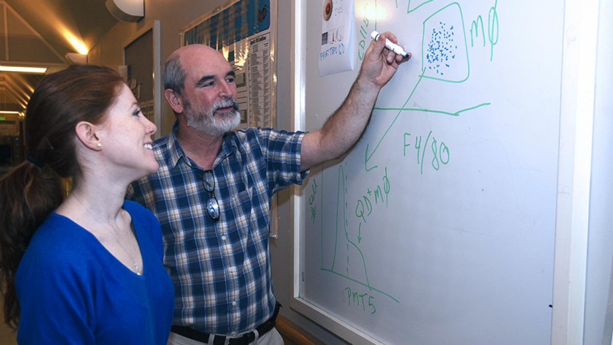 DEOHS Professor Terry Kavanagh talks with a student. Photo: Sarah Fish