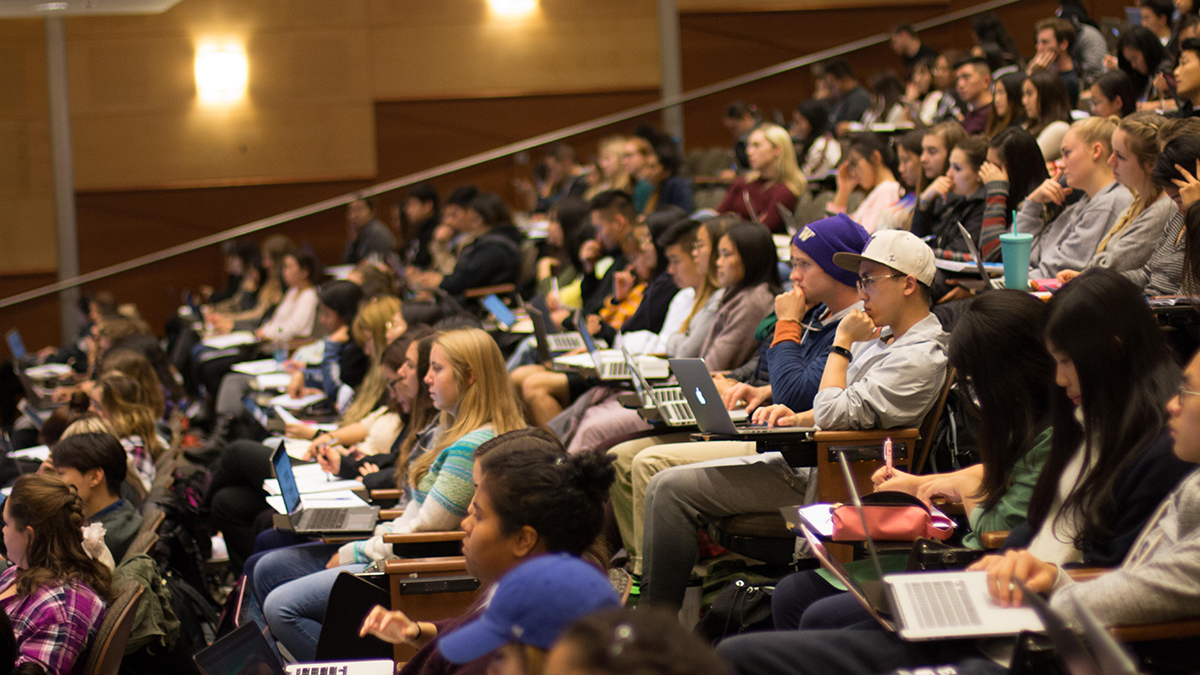 UW students listen to a lecture in a lecture hall.
