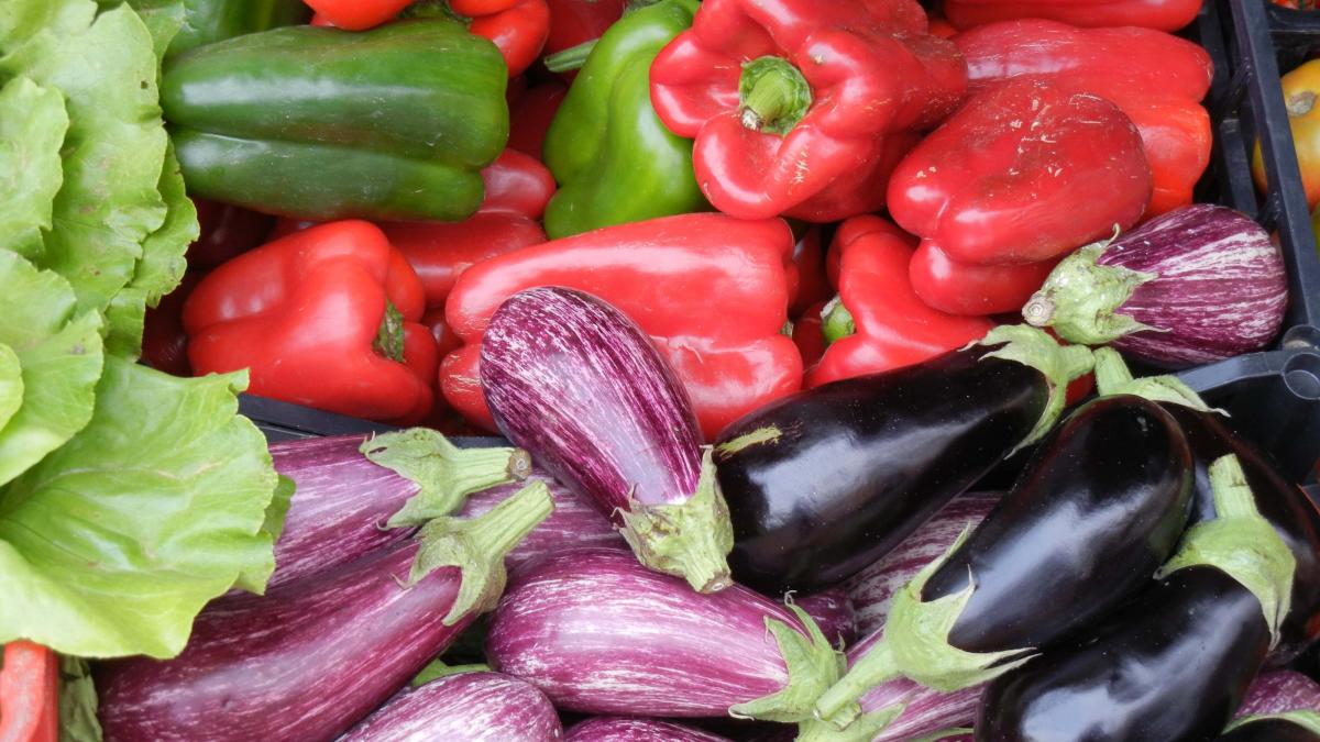 Close-up of bell peppers and eggplant.