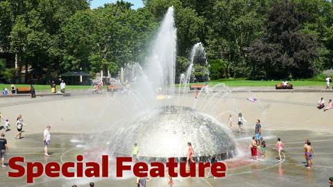 Families paying in fountain with the words 'Special Feature' over the top. 