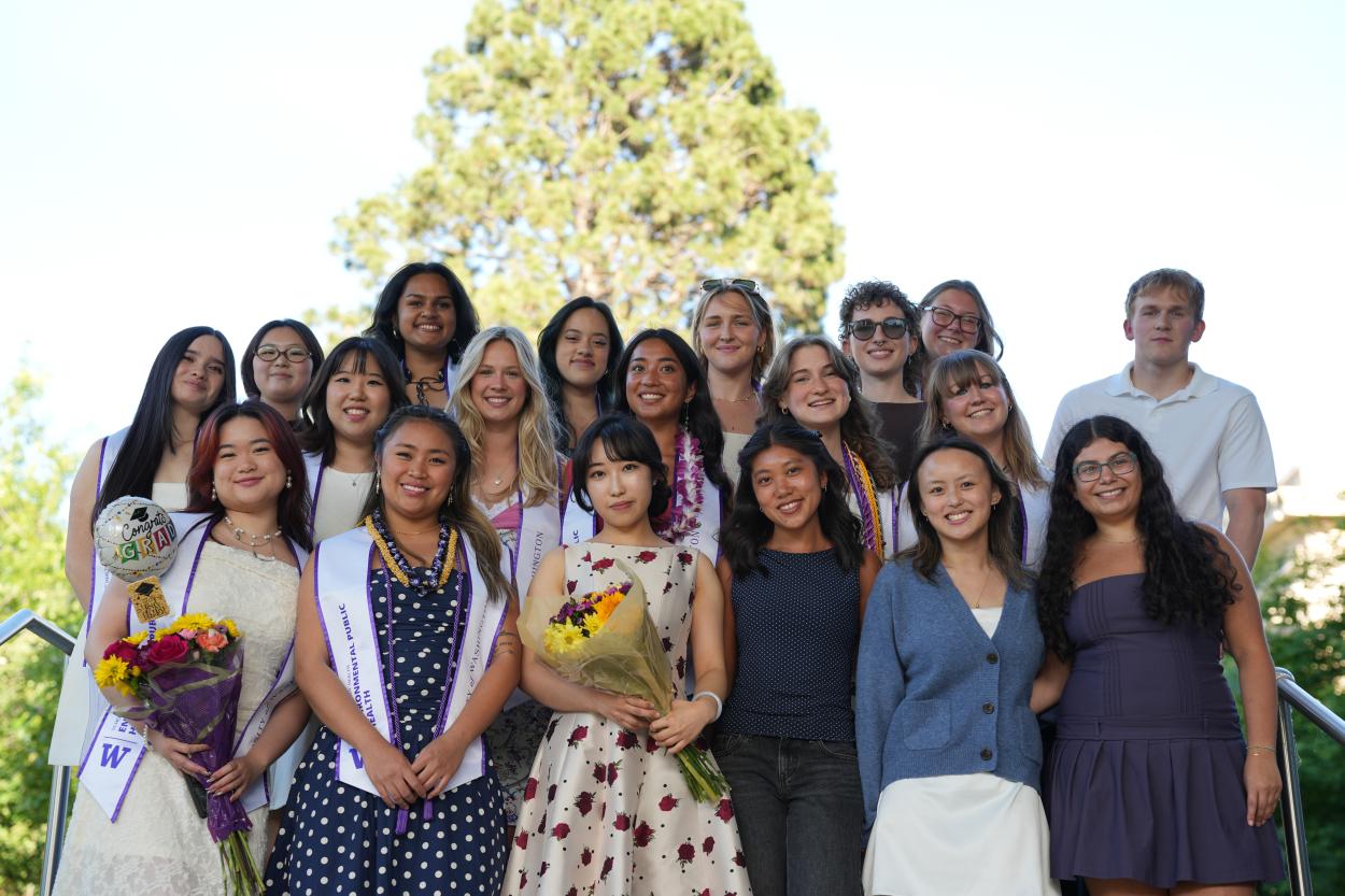 A large group of undergraduate students standing outside celebrating graduation.