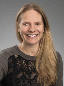 Dr Curl, a young white woman with long blond hair