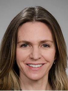 Dr Cherry, a middle-aged white woman with shoulder-length brown hair