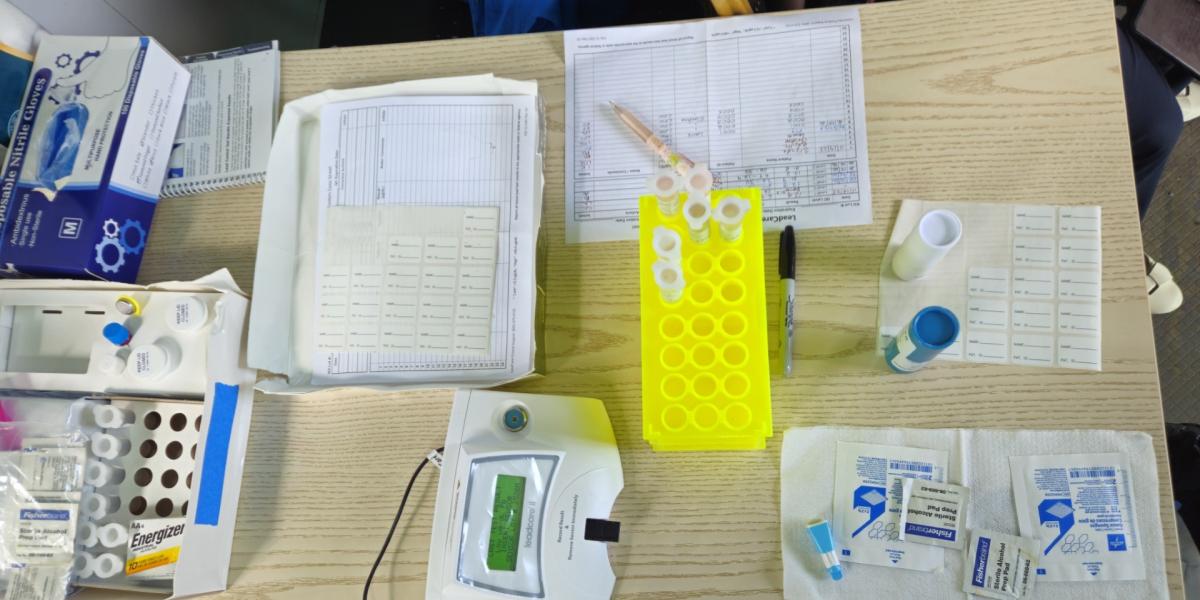 A table holds the materials needed for lead level testing